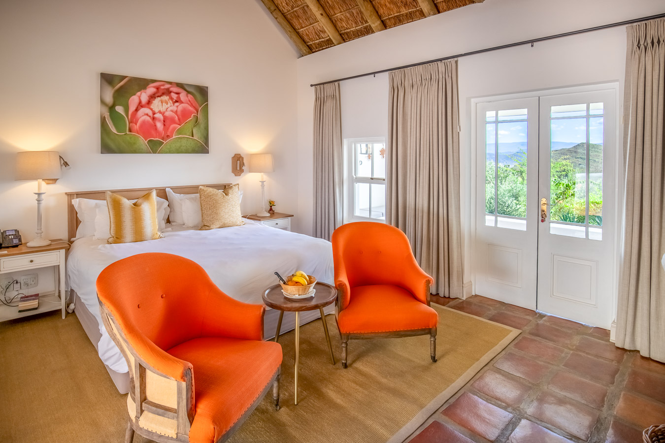 Galenia Estate House interior — exposed tree-trunk ceiling and Cape Dutch architecture